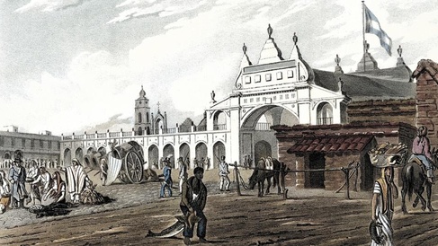 Historic illustration of a bustling marketplace in Buenos Aires around 1820, showing people trading goods, horse-drawn carts, and a prominent white colonial building with arches and a flag flying above.