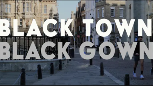Large white text reading “BLACK TOWN BLACK GOWN” over a street scene in Cambridge, with historic buildings and railings visible in the background.