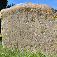 Close-up of Anna Maria Vassa’s gravestone in Chesterton churchyard, showing its weathered inscription.