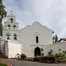 Mission San Diego de Alcalá, a white Spanish colonial church with a bell tower