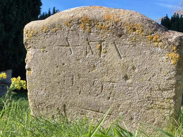 Close-up of Anna Maria Vassa’s gravestone in Chesterton churchyard, showing its weathered inscription.