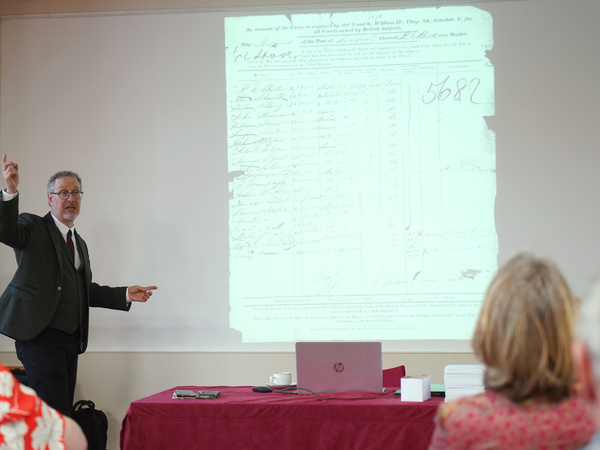 Dr Mark Tumbridge presenting archival records associated with the Hesperus voyage during a seminar on slavery and indentureship in the Caribbean.